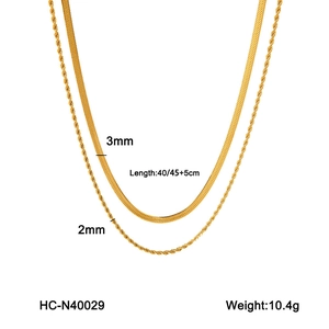 Detail of layered 3mm gold snake chain and 2mm rope necklace with size and weight info