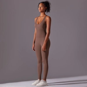 Detail view of coffee brown seamless yoga jumpsuit with ribbed texture and U-neck design