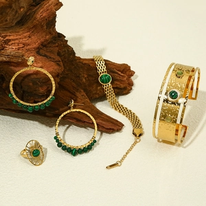 18k gold plated jewelry set featuring green malachite stones on wooden display base