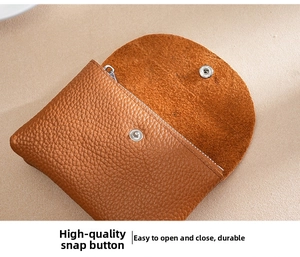 Detail of genuine leather coin purse with durable silver snap button and tidy stitching