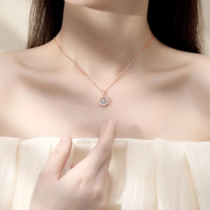 Elegant rose gold sunflower necklace with a sparkling white center stone on a silver chain