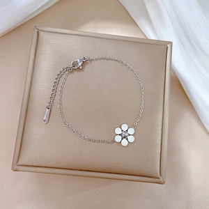 Detail of silver titanium steel flower bracelet with lobster clasp and adjustable chain link