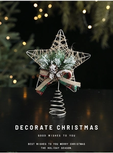 Detail of Christmas tree star topper with pine cones, burlap bow and silver wire coil