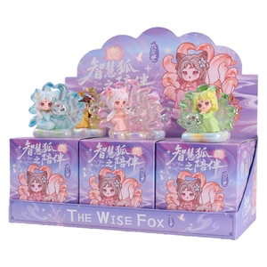 The Wise Fox collection featuring colorful nine-tailed fox figurines on a display stand