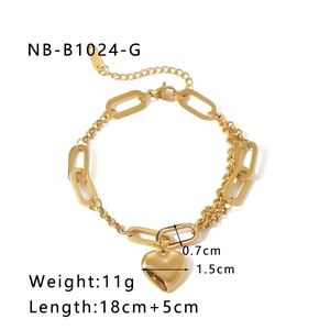 Detail of 18k gold plated stainless steel heart bracelet with mixed link chain design