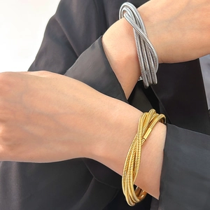 Minimalist multi-layer metallic coil bracelet in gold and silver finish for women