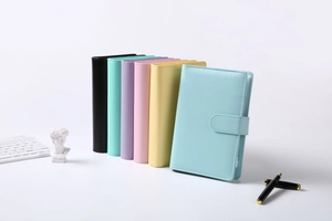 Close-up of vibrant A6 PU leather notebooks featuring secure magnetic buckle closures