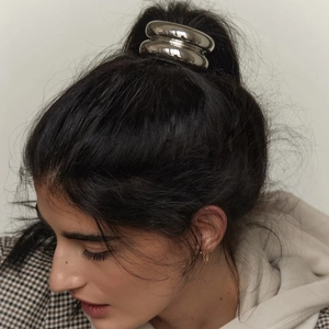 Polished silver stainless steel hair tie featuring a minimalist double-ring hairband design