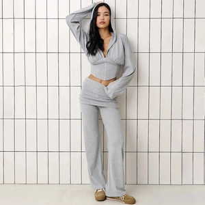 Detail view of women's grey two-piece set featuring a crop hoodie and wide-leg trousers