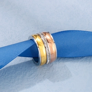 Classic tri-color band ring with zircon pave setting on a stylish blue ribbon display