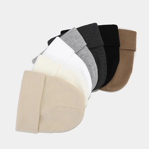 Classic knitted beanie hats in seven solid neutral colors with folded cuffs and fine texture