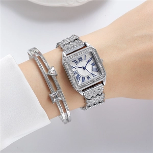 Detail of square silver watch with rhinestones and matching crystal cuff bracelet