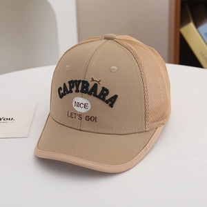 Detail of khaki mesh baseball cap featuring navy blue embroidered letters and breathable back