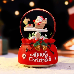 Merry Christmas snowflake ball ornament with red resin base and festive glass globe