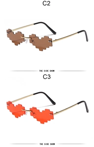 Detail view of pixel art heart-shaped sunglasses in tea and red lens variations