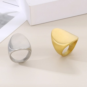 Minimalist 18K gold and silver titanium steel rings with brushed metallic texture