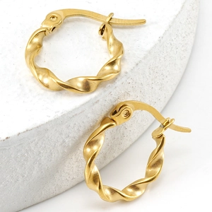 Chic 18K gold plated stainless steel twisted spiral hoop earrings for women on stone