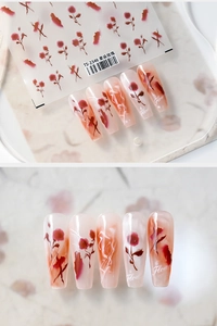Close-up of 5D blooming rose nail stickers with delicate floral textures and art lettering