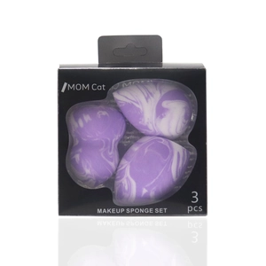 Detailed view of three purple marble makeup sponges in a branded window box
