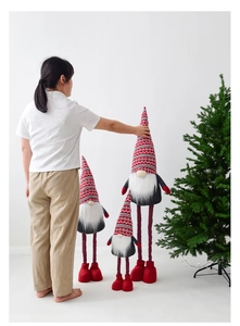 Three sizes of telescopic Christmas gnomes with knitted hats and long white beards