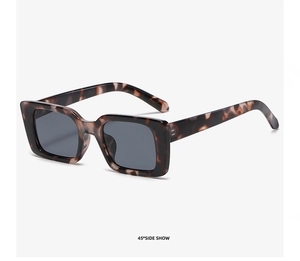 Detailed 45-degree side view of leopard pattern square sunglasses with metal hinges