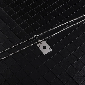 Detailed close-up of Ace of Spades and Hearts pendant on a silver titanium steel chain