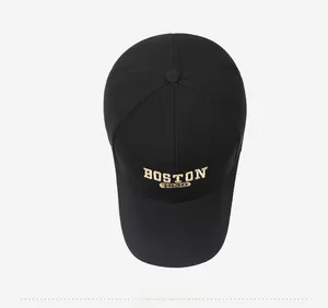 Top view of black baseball cap with golden BOSTON 1930 embroidery and stitching detail