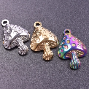 Detailed view of mushroom pendants in silver, gold, and rainbow vacuum plating finishes
