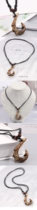 Detail showing carved resin fish hook pendant with wooden beads and size measurements