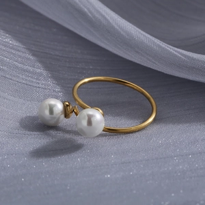 Close-up of dual white pearls on a gold plated 18K stainless steel open cross ring