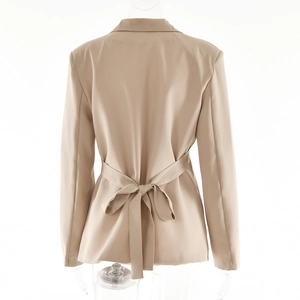 Rear view of a beige cardigan blazer featuring an adjustable drawstring back waist detail