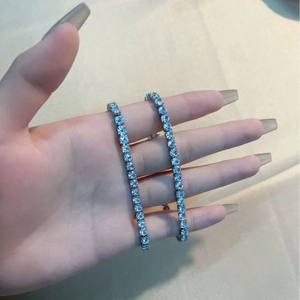Sparkling silver tennis bracelet featuring round light blue cubic zirconia stones for women