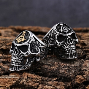 Vintage Viking skull rings in silver and gold finish with Masonic emblem on wood base