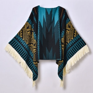 Ethnic knit poncho featuring geometric tribal patterns and beige tassels in dark tones