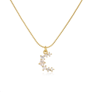 Detailed macro shot of 18K gold plated brass crescent moon pendant with zircons