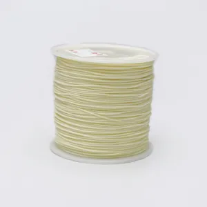 Cream 0.8mm nylon cord on plastic spool for handmade jewelry and DIY knotting projects
