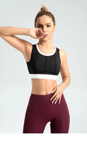 Close-up of high-impact yoga bra with vertical stripes and burgundy fitness leggings