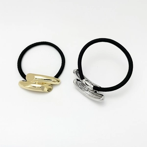 Detail of high-elasticity hair ties featuring gold and silver twisted alloy metal buckles