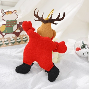 Detail of plush Christmas reindeer ornament with plaid patterns for festive tree decor