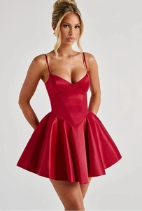 Detailed close-up of a red satin corset mini dress featuring a fitted waist and flared skirt
