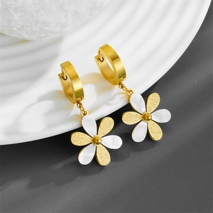 Elegant gold titanium steel floral drop earrings with white enamel petals on white dish