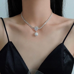 Elegant gold-plated necklace with zircon stones and a drop-shaped pearl pendant