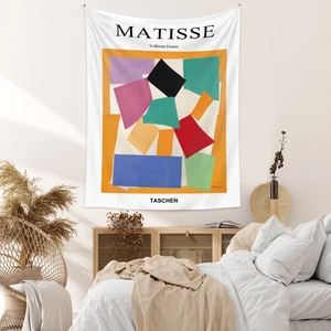 Detail of Matisse style wall tapestry hanging as a decorative background in a cozy bedroom