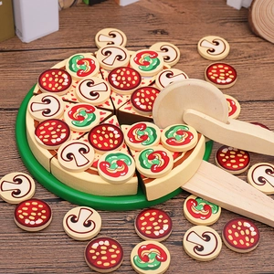 Wooden kids play kitchen pizza set with slicer and toppings on a green tray