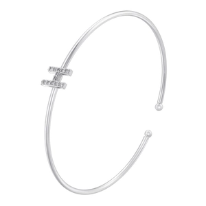 Macro shot of sparkling zirconia paved letter H on a silver adjustable open cuff bracelet