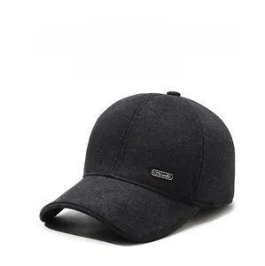 Close-up of thick grey wool texture and Sports metal logo on ear-protection baseball cap