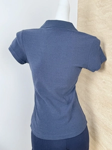 Back view of a navy blue polo shirt with knitted texture on a white mannequin
