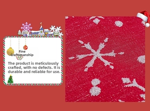 Close-up of red festive fabric with white snowflake pattern and shimmering texture