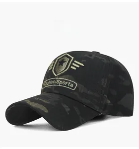 Detailed close-up of dark camo baseball cap featuring gold shield star embroidery