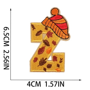 Detailed size view of letter Z alphabet embroidery patch with autumn leaf and knit hat design
